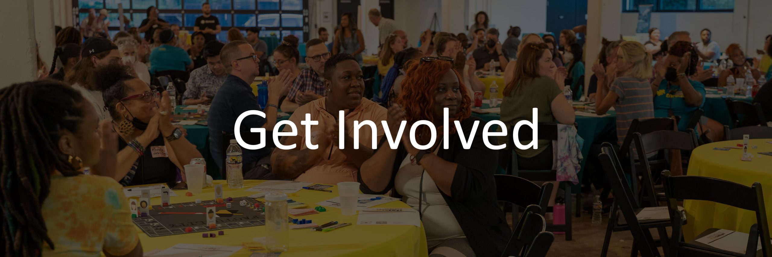 website-header-get-involved A darken image of a group of Thread staff and community members at August 2022 threadTALK. Overlay text reads "Get Involved"