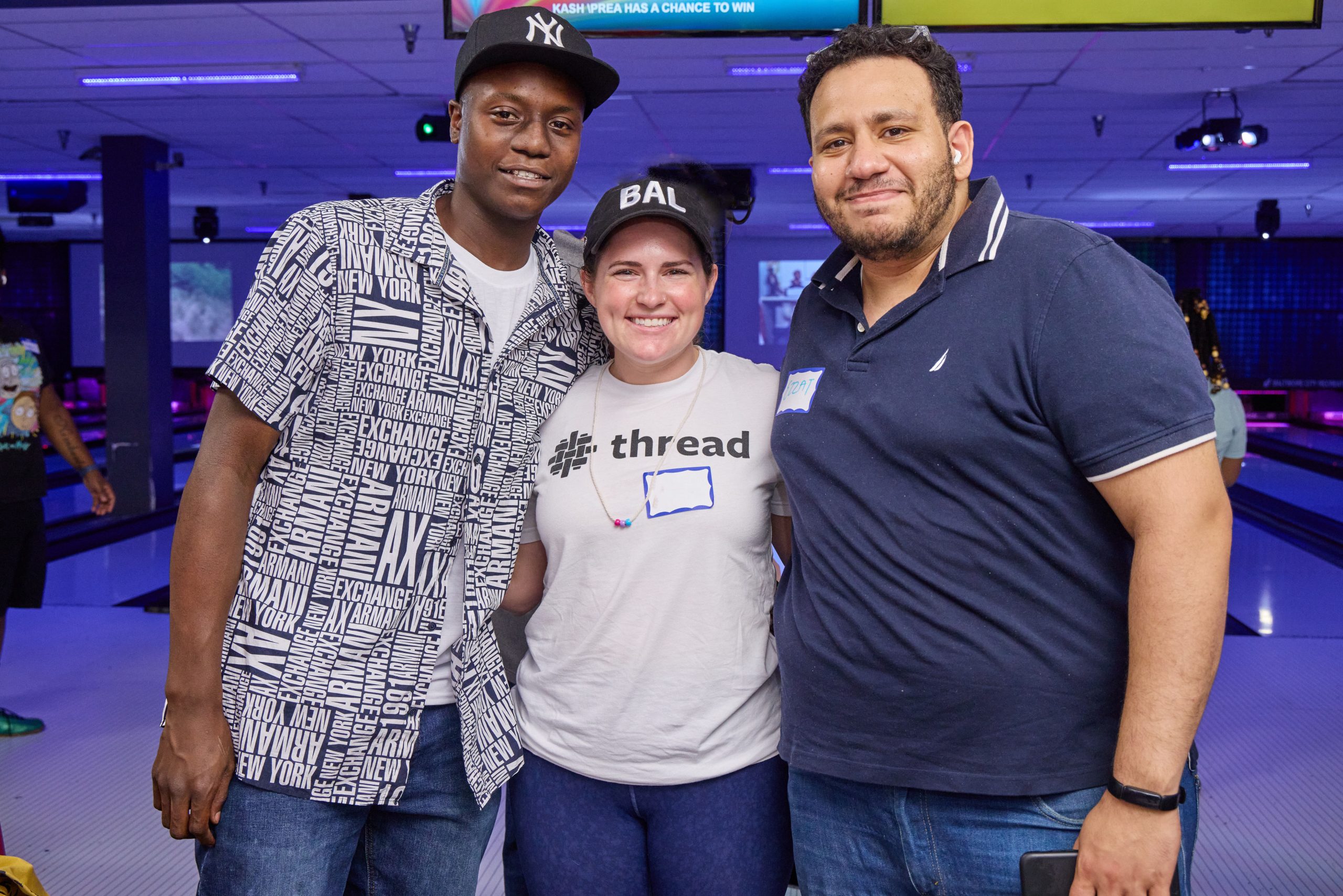 Thread Community Event Two volunteers and one young person pose together at June 2022 threadTALK