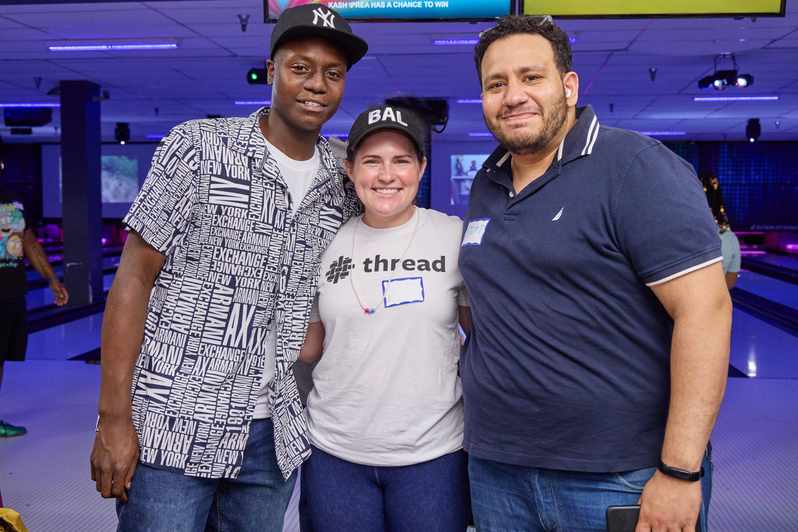 Two volunteers and one young person pose together at June 2022 threadTALK